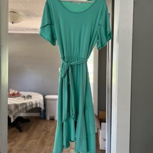 Turquoise dress from Jane. Tulip sleeves and high low hem.. Size XL.